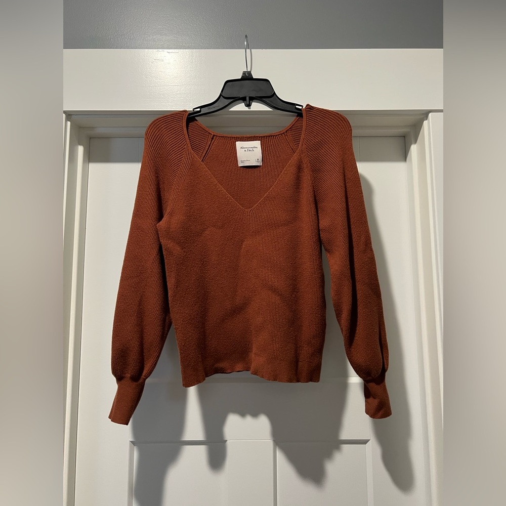 Abercrombie and Fitch sweater
V neck and puff sleeves
Size Medium